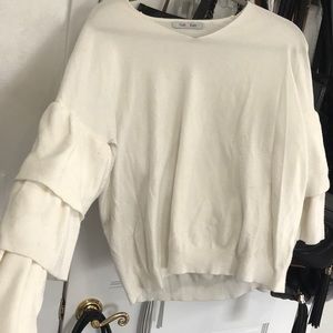 White/ivory/offwhite ruffle sleeve sweater. Size M
